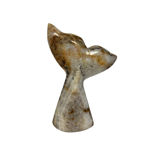 marble sculpture of a whale tail