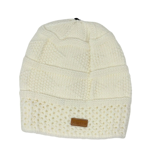 White knit beanie with a brown Alaska patch on a white background