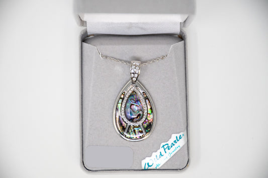 Teardrop-shaped pendant with silver setting on a branded box.