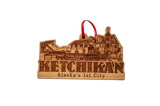 Wooden ornament with engraved Ketchikan design and text on a white background