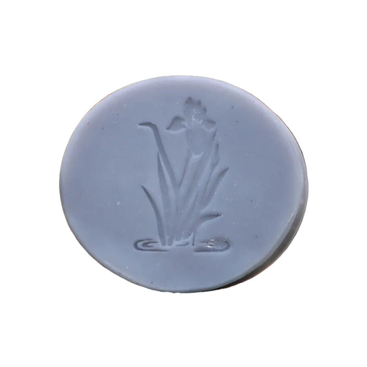Round soap bar with a floral engraving