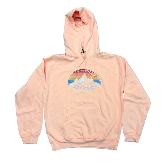 Pink hoodie with a mountain and rainbow design on a white background