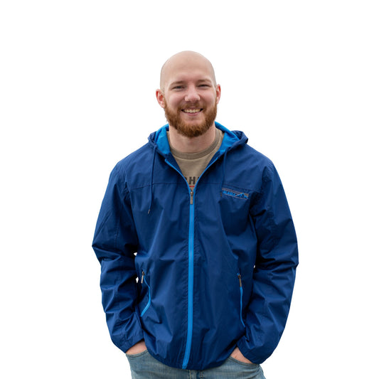 Man wearing a blue jacket with Alaska logo on a white background