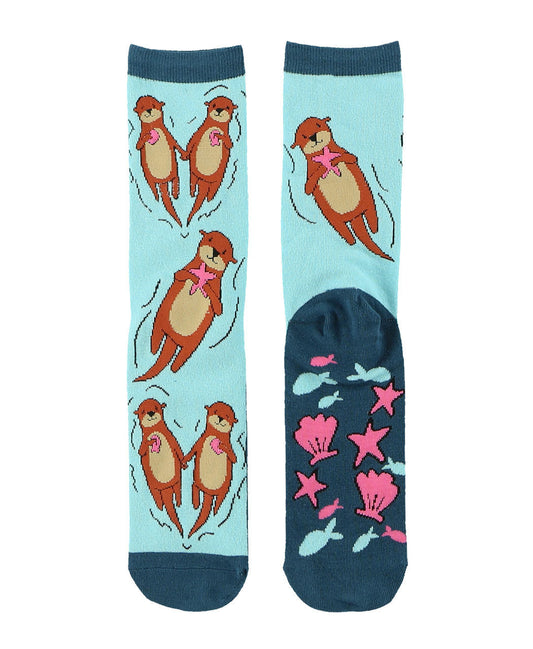 Socks with otter and sea shell design on a light blue background