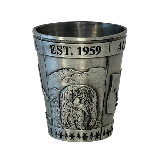 Silver shot glass with bear design and 'Est. 1959' text on a white background