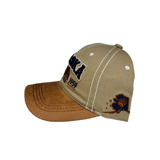 Two-tone cap with brown front and beige back on a white background