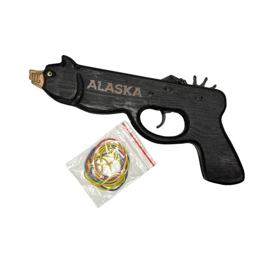 Toy rubber band gun with 'Alaska' branding and a package of rubber bands