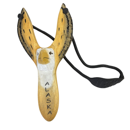 Wooden slingshot with an eagle design and 'Alaska' text