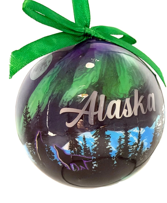 Decorative ornament with 'Alaska' text and green ribbon