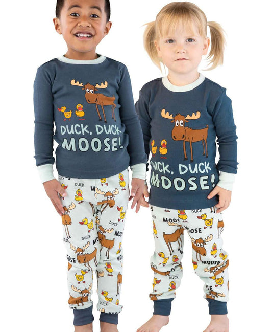 Two children wearing matching pajamas with a moose and duck design.