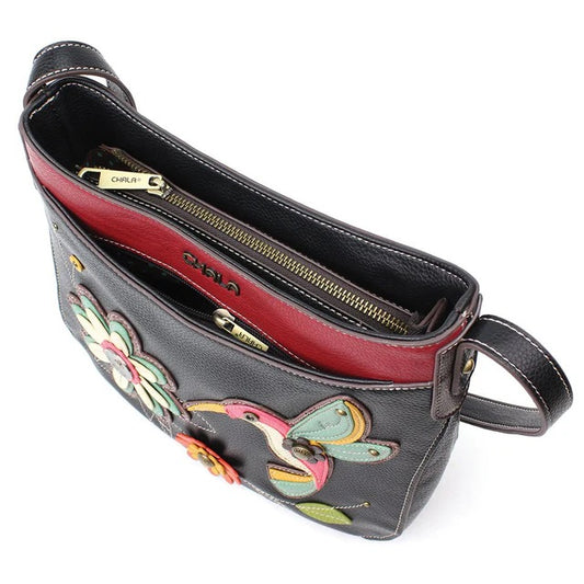 Handbag with floral and hummingbird designs on a white background