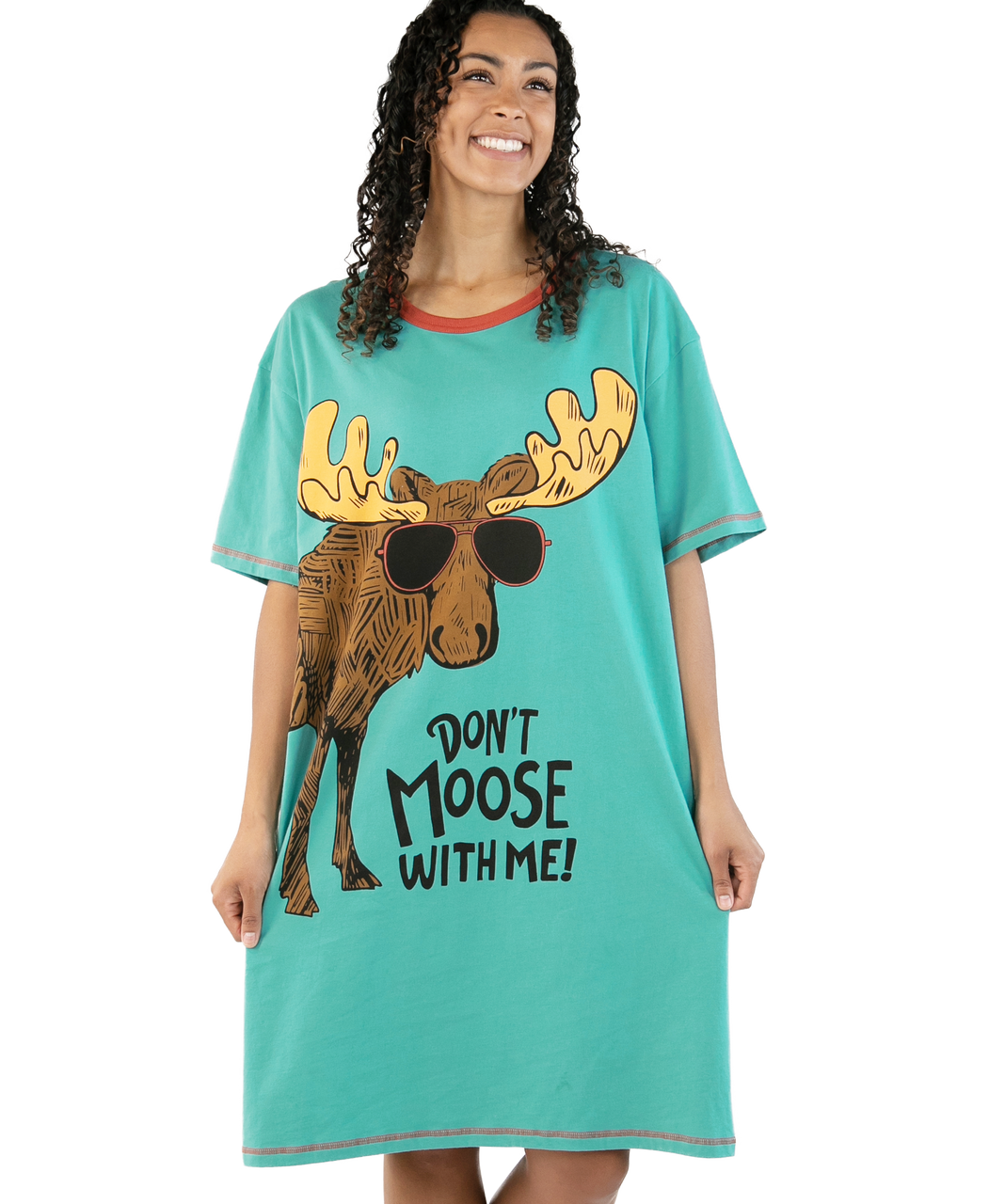 Woman wearing a teal nightshirt with a moose graphic and text on a white background