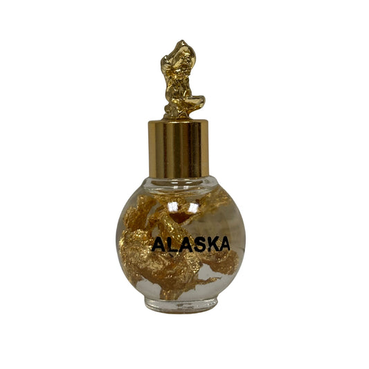 Small bottle labeled 'Alaska' with a gold cap on a white background