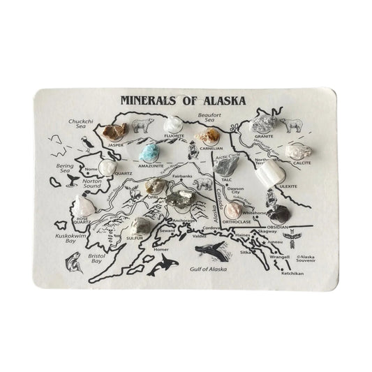 Map of Alaska with various minerals displayed on a white background