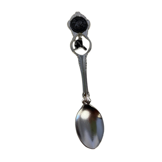 Decorative spoon with an alaska charm