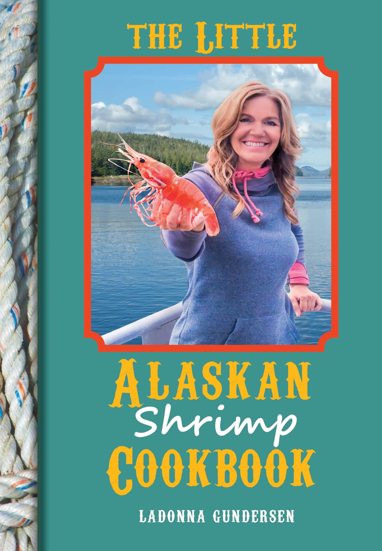 Cookbook cover featuring a woman holding shrimp with a scenic background