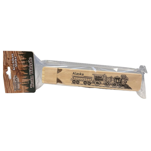 Wooden whistle with train design and 'Alaska' text, packaged in clear plastic on a white background.
