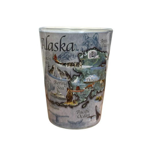 Alaska themed shot glass featuring wildlife and landmarks