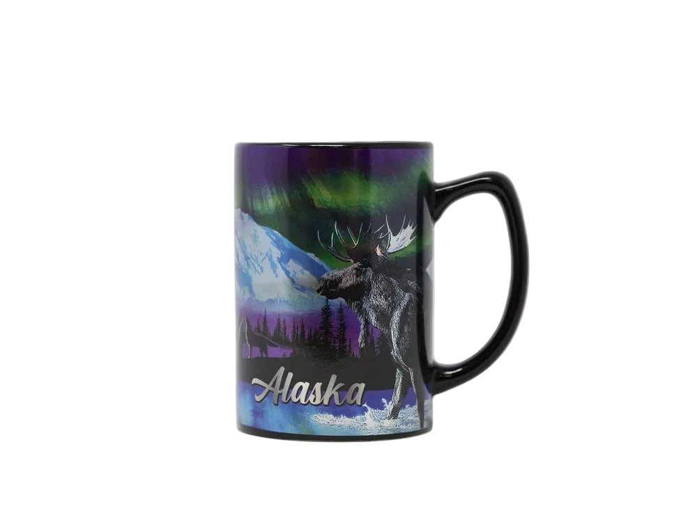 Mug with a design of a moose and Northern Lights, labeled 'Alaska', on a white background.