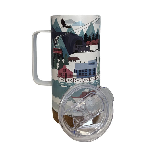 Travel mug with a scenic design featuring mountains, trees, and buildings