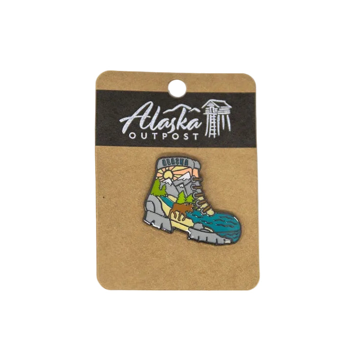 Colorful boot-shaped pin on a card with 'Alaska Outpost' branding