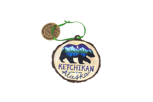 Decorative ornament with bear design and 'Ketchikan Alaska' text on a white background