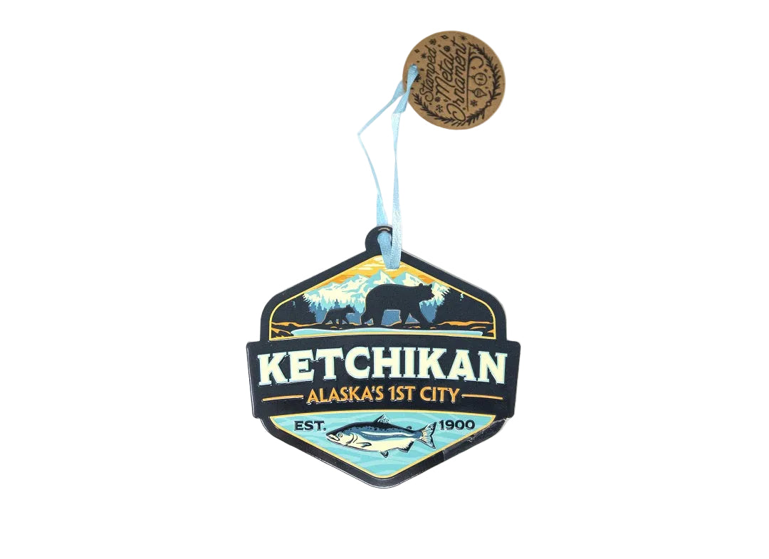 Decorative sign with 'Ketchikan, Alaska's 1st City' text and nature-themed design on a white background.