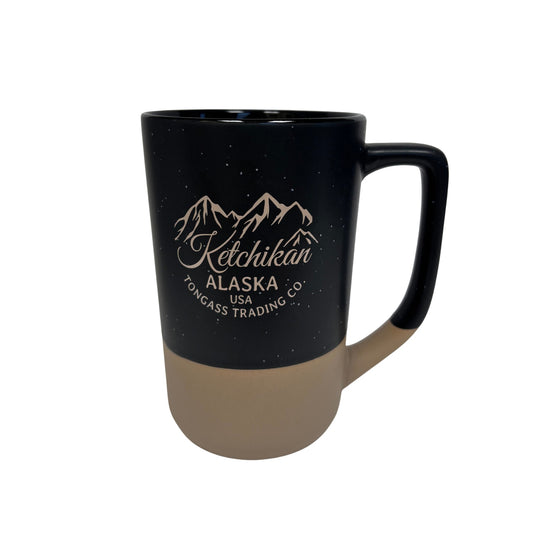 Black mug with beige bottom and Ketchikan Alaska text