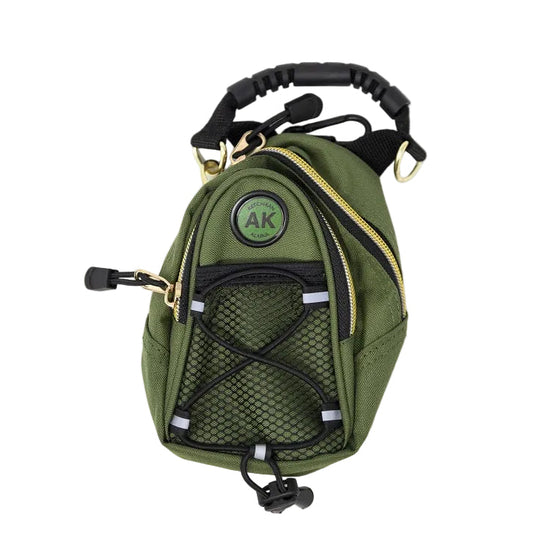 Green day pack with a handle and mesh side on a white background