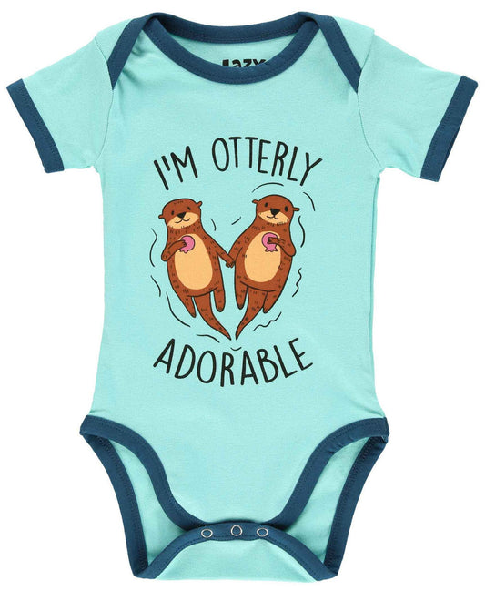 Light blue baby onesie with cartoon otters and "I'm Otterly Exhausted" text on a white background