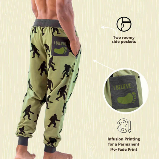 Green jogger pants with bigfoot print and 'I Believe' text on a beige background
