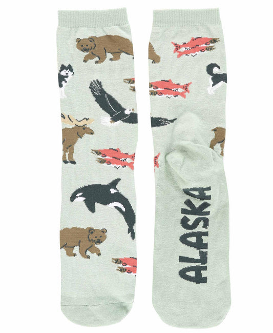 Socks with Alaska-themed design featuring bears, fish, and an orca on a light green background.