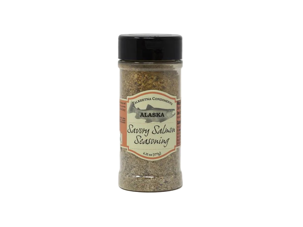 Bottle of savory salmon seasoning with a label on a white background