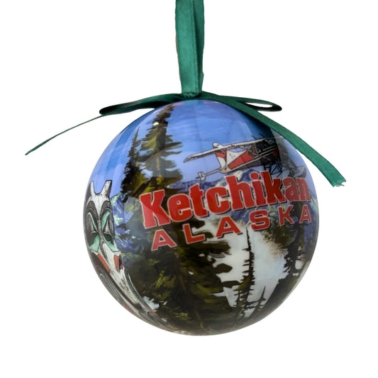 Decorative ornament with 'Ketchikan Alaska' text and scenic design on a white background