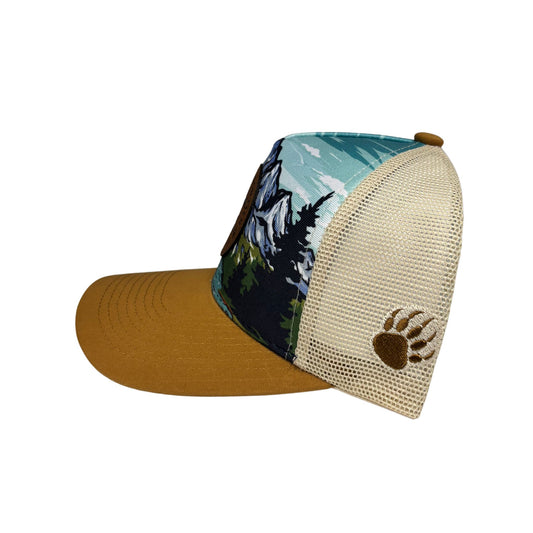 Cap with mountain and bear paw design on a white background