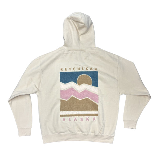 Beige hoodie with fluffy mountain graphic and 'Ketchikan Alaska' text