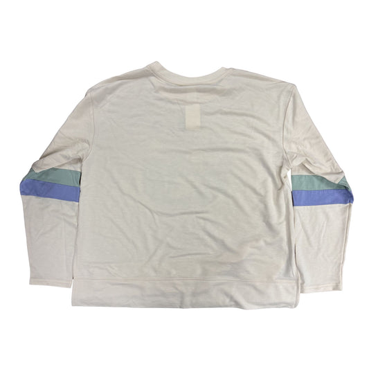 Light long-sleeve shirt with blue and green accents on sleeves against a white background