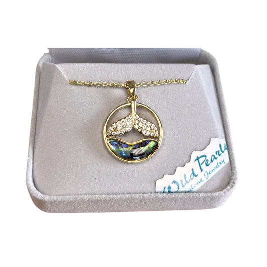 Golden necklace with a whale tail