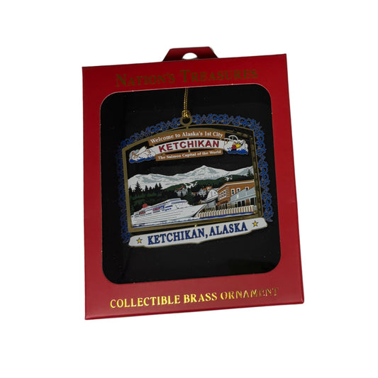 Collectible brass ornament of Ketchikan, Alaska in packaging with red box.