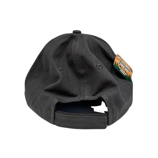 Black cap with a brand tag on a white background