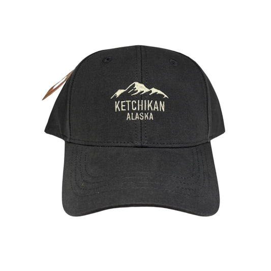 Black cap with 'Ketchikan Alaska' text and mountain graphic on a white background