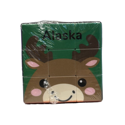 Packaged toy with a moose design and 'Alaska' text on a green background