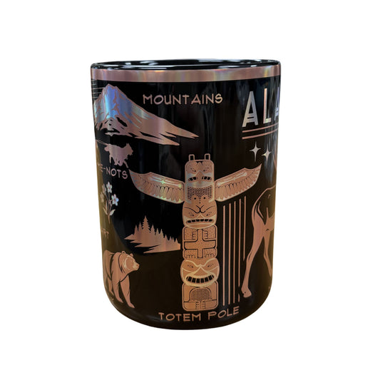 Mug with nature-themed design featuring mountains, animals, and a totem pole