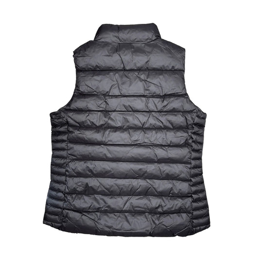 Black puffer vest on a white background