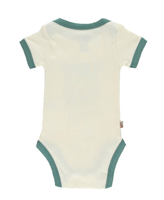 Beige baby onesie with green trim on a white background