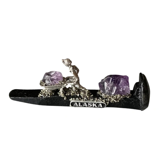 Train Spike with a mining figure pushing Amethyst in a wheelbarrow