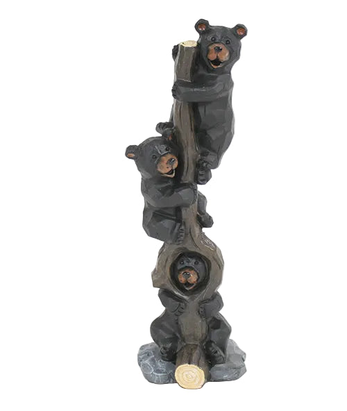 Statue of three bears climbing a tree log on a white background
