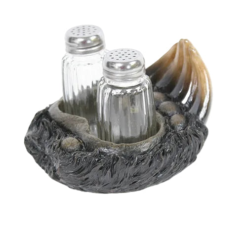 Salt and pepper shakers in a bear paw