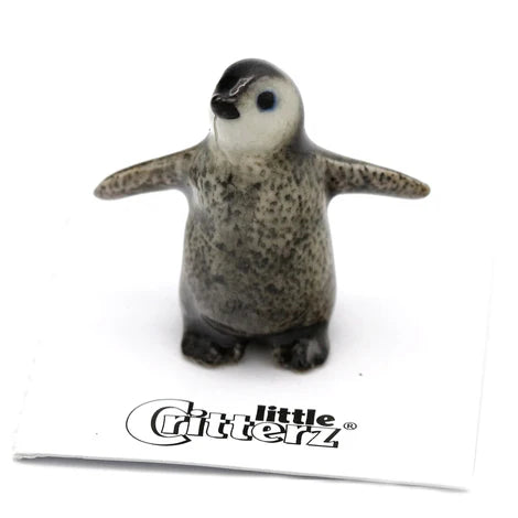 Small penguin figurine with 'Little Critterz' branding