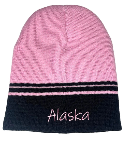 Pink and black beanie with 'Alaska' embroidery on a white background